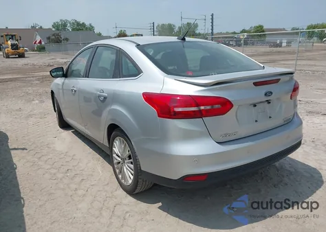 2015 Ford Focus Titanium z USA, uszkodzony, nr VIN 1FADP3J24FL280341